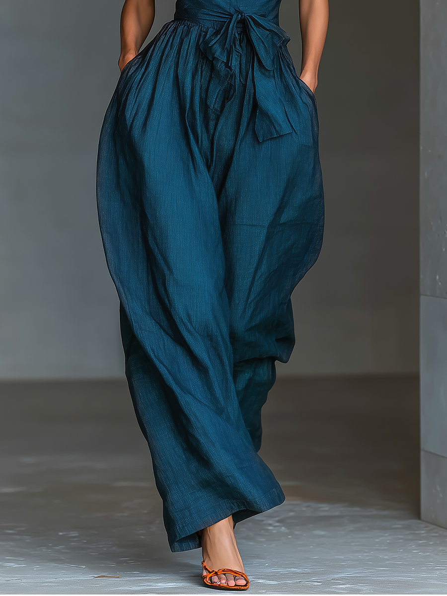 Jumpsuit i hørstof med krydsholder, vide ben, bindebånd i taljen & sidelommer