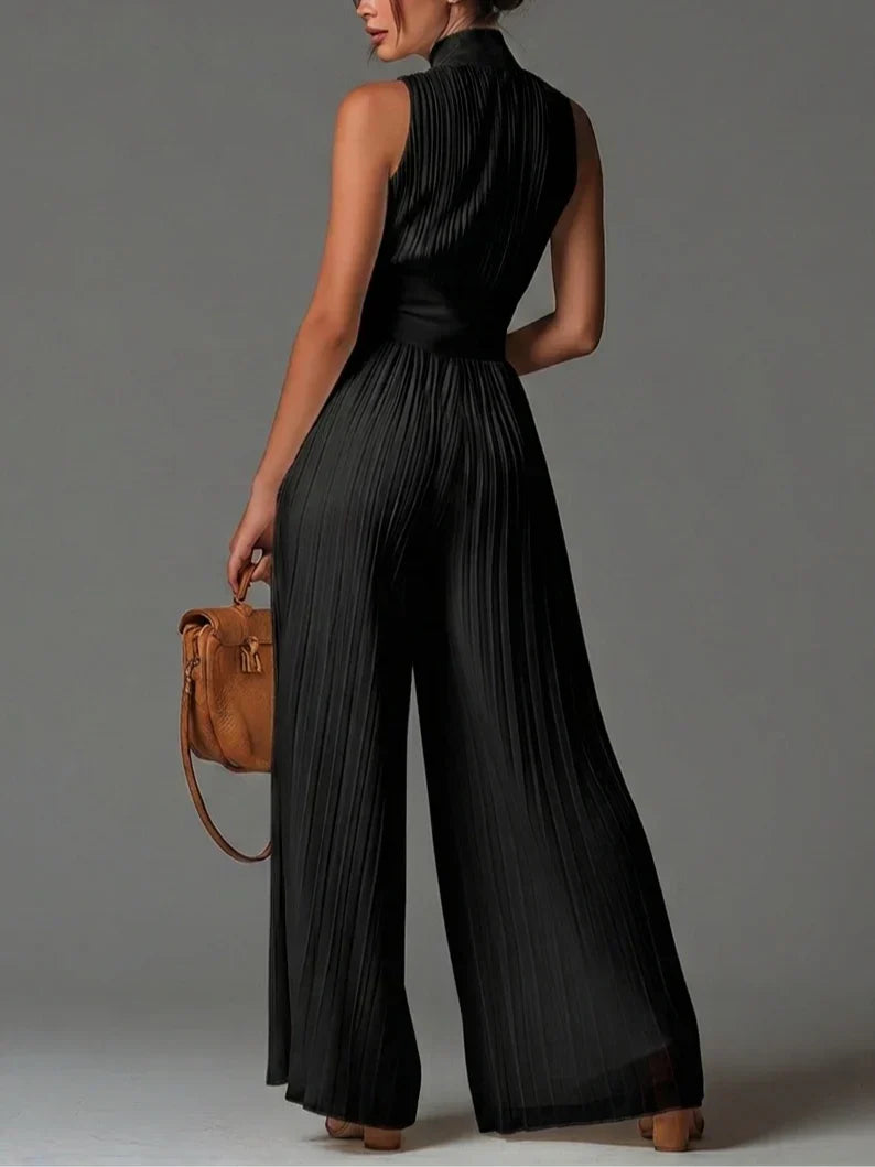 ÉLAN - Skulpturelt plisseret jumpsuit