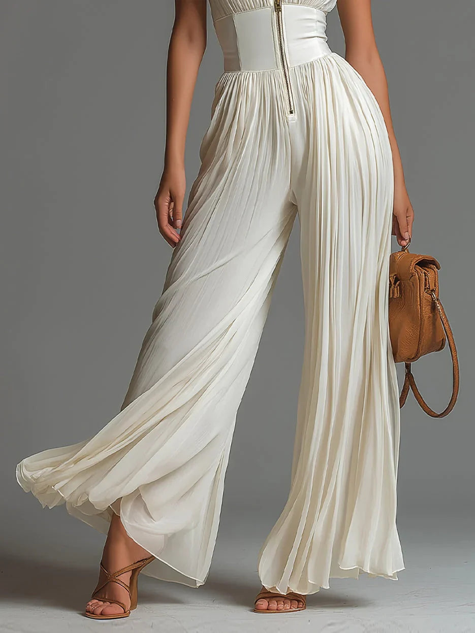 ÉLAN - Skulpturelt plisseret jumpsuit