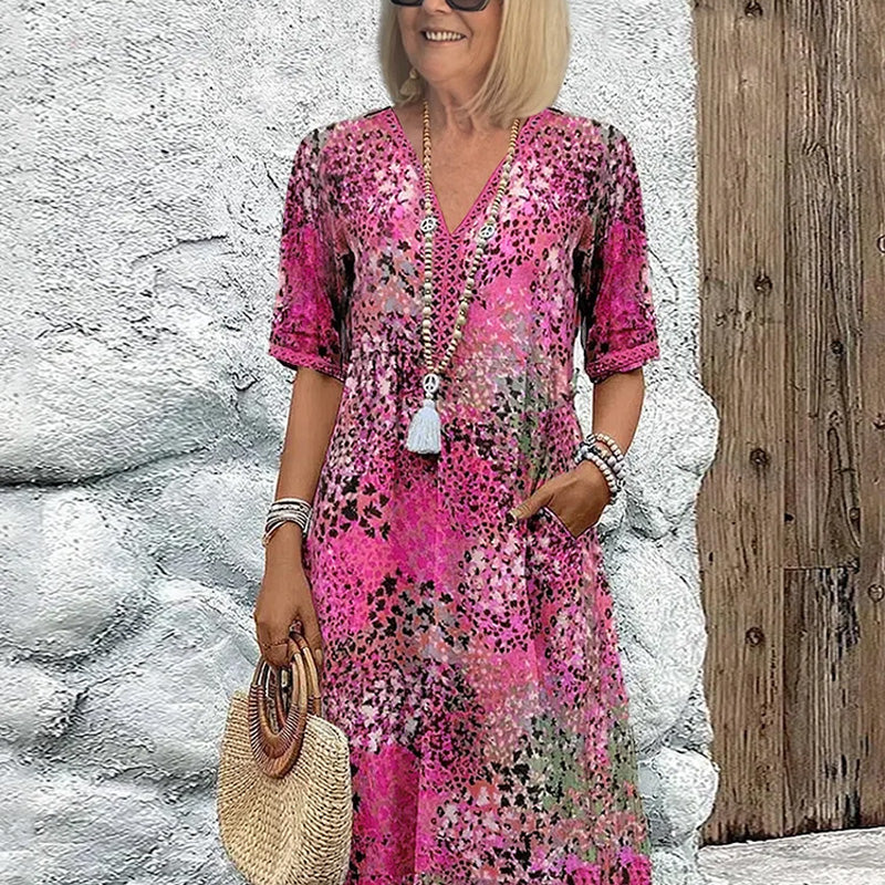 Amalia – Farverig midi-kjole med V-hals